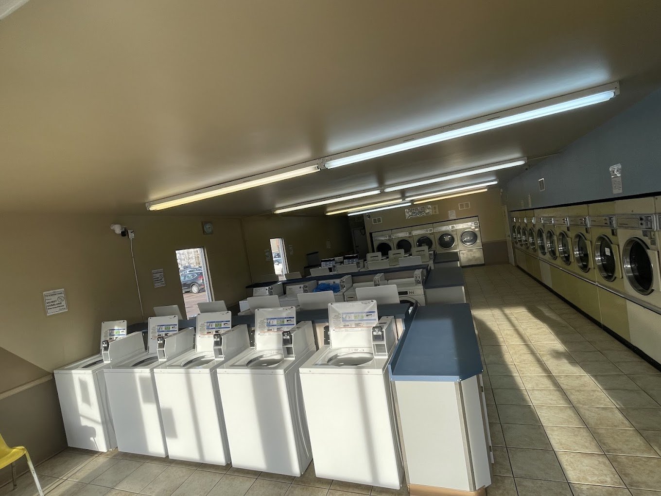 Rows of washers and dryers inside Mountain Laundromat